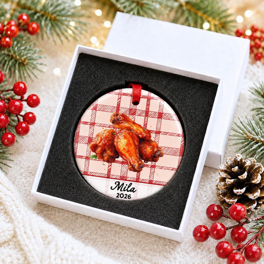 Personalized buffalo wings ceramic ornament with name and year on red plaid in a white gift box with protective foam