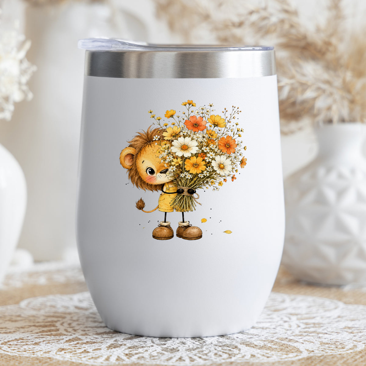 Baby Lion Holding Wildflower Bouquet UV DTF sticker applied to a white stemless tumbler with a lid
