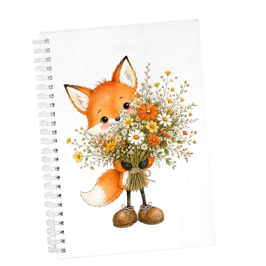 Orange Fox Holding Flower Bouquet UV DTF sticker applied to the cover of a white spiral journal