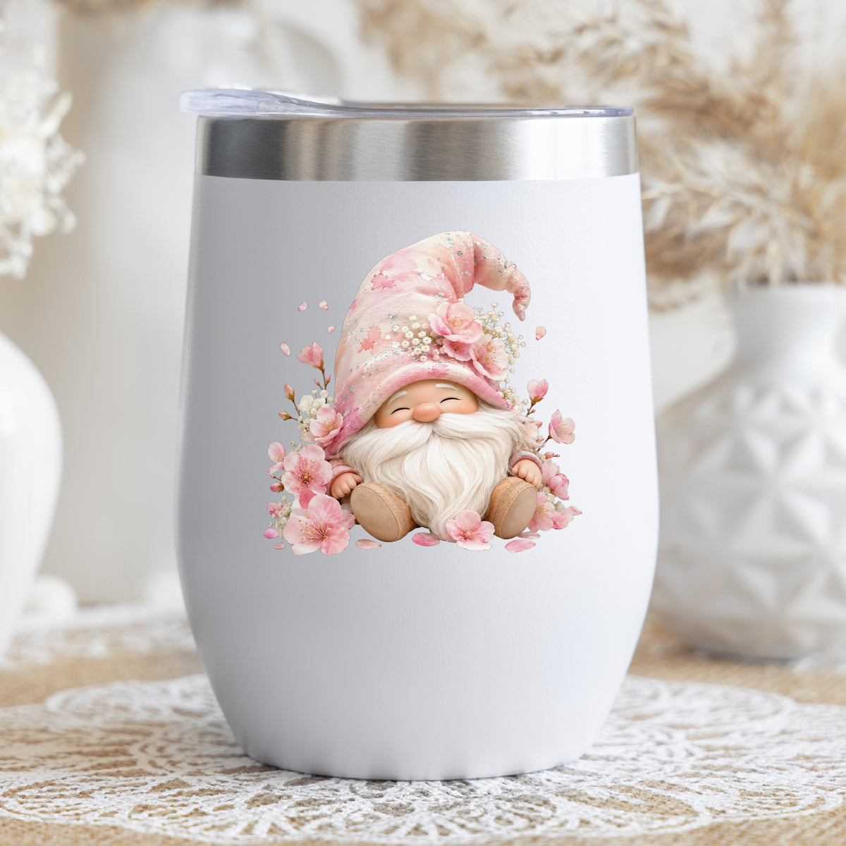 Cherry Blossom Gnome UV DTF sticker applied to a white stemless tumbler with a lid