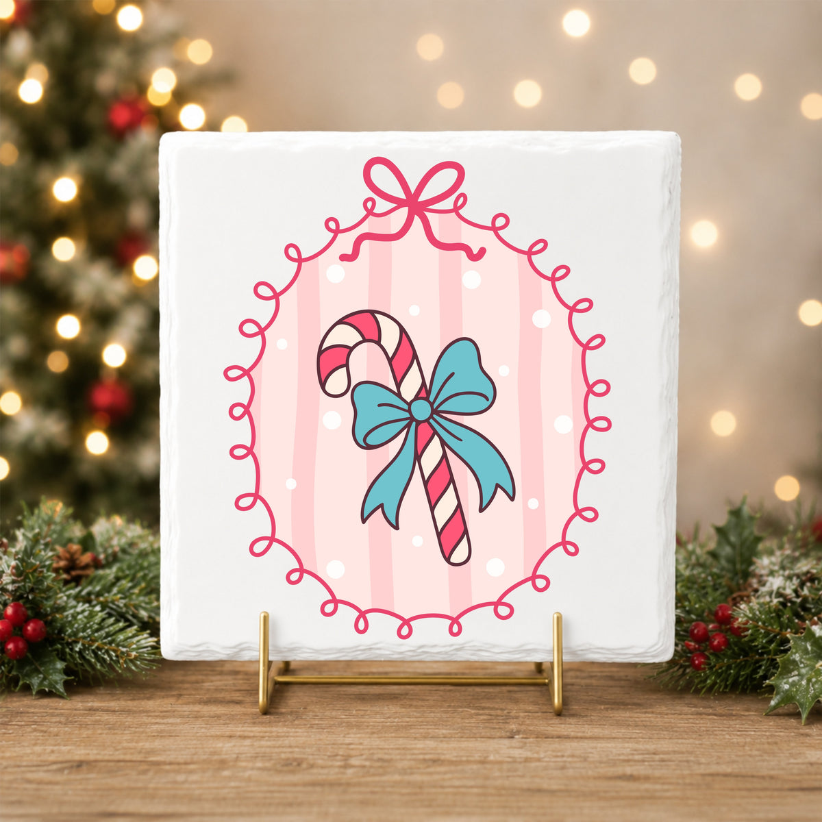 Coquette Candy Cane UV DTF sticker applied to a white tile on a gold stand
