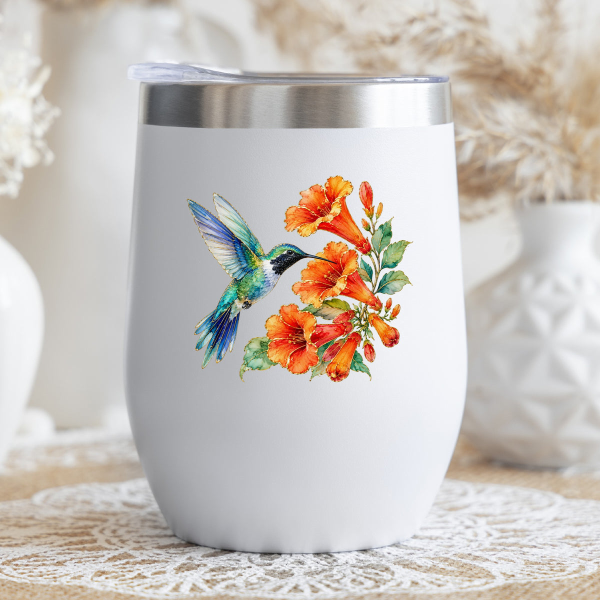 Blue Hummingbird Trumpet Flowers UV DTF sticker applied to a white stemless tumbler with a lid