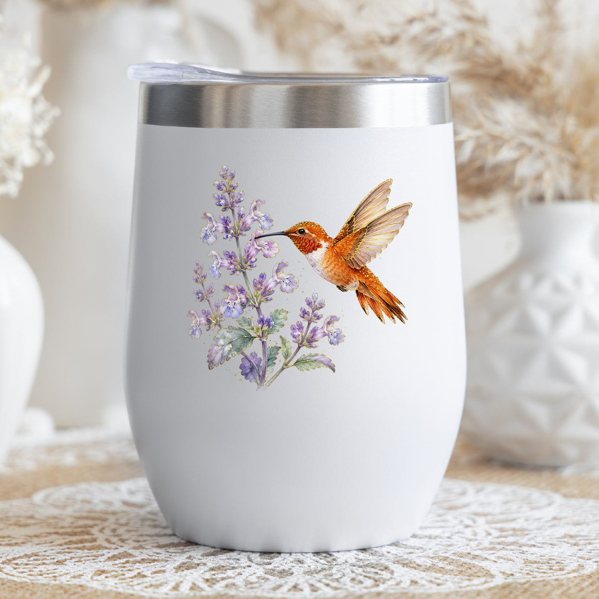 Rufous Hummingbird Lavender UV DTF sticker applied to a white stemless tumbler with a lid