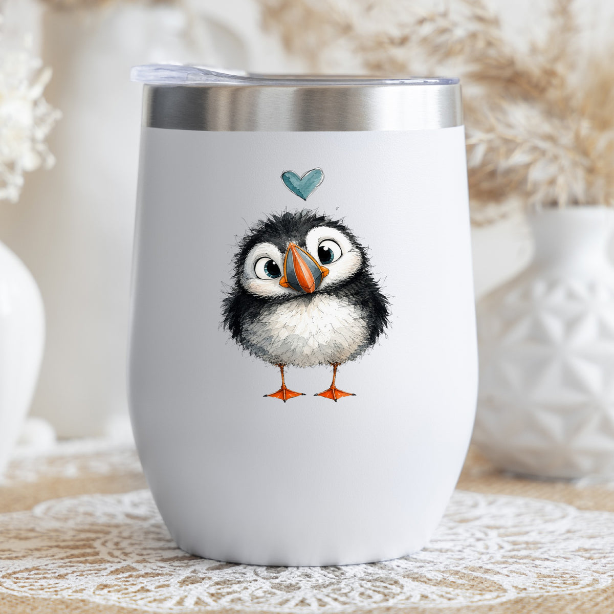 Funny Puffin UV DTF sticker applied to a white stemless tumbler with a lid