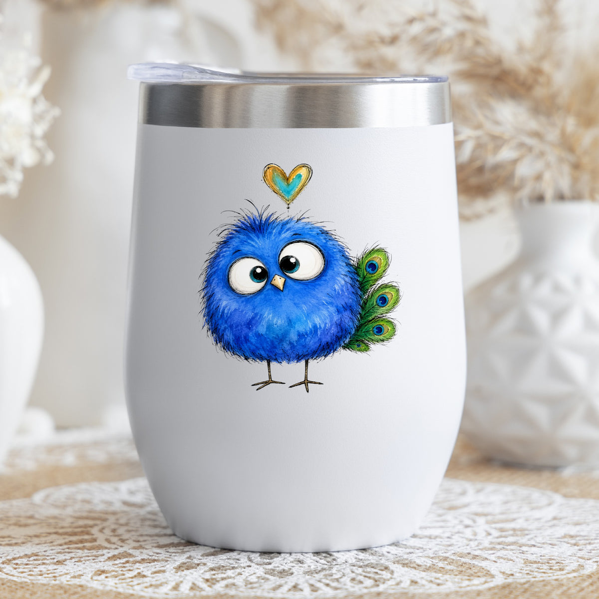 Funny Blue Peacock UV DTF sticker applied to a white stemless tumbler with a lid