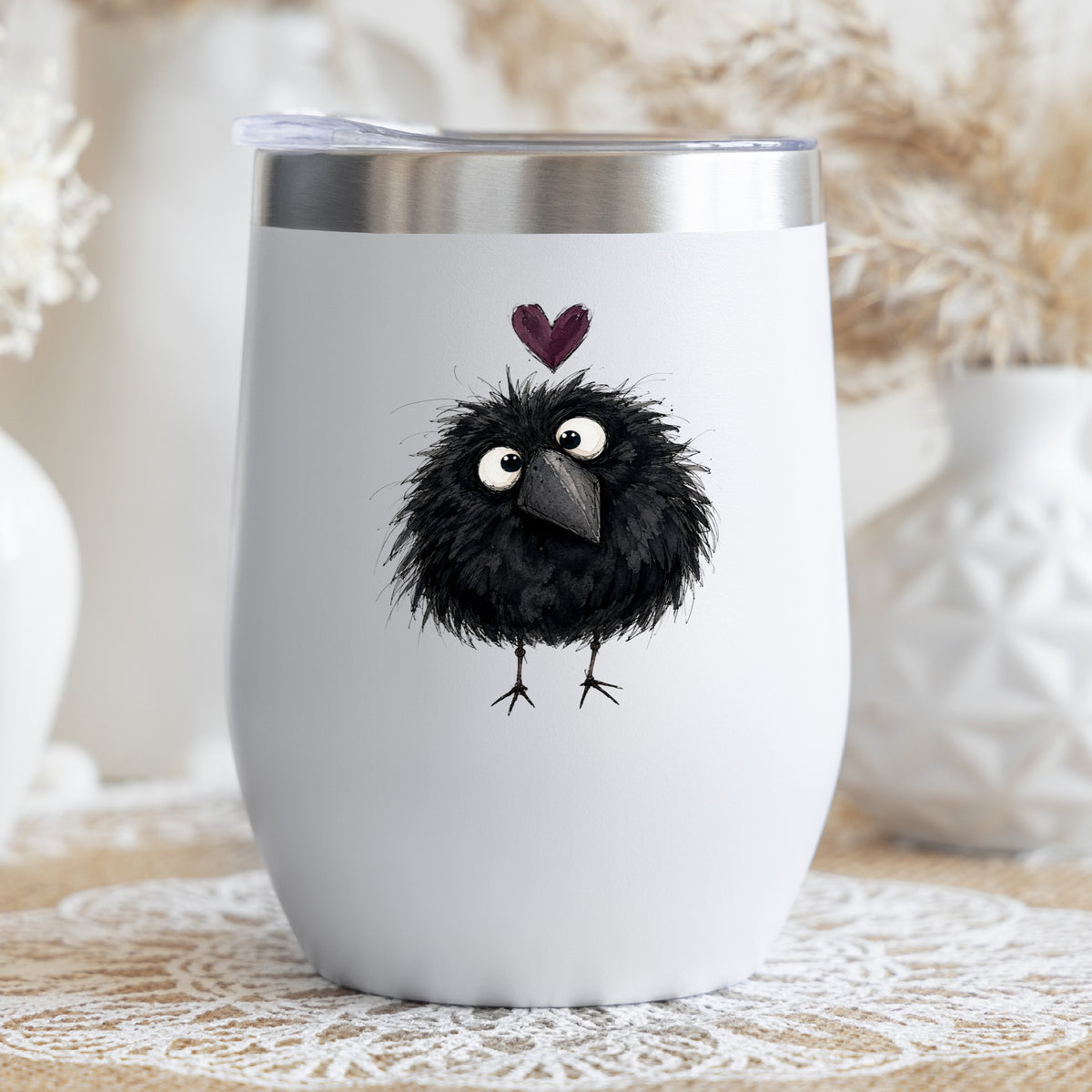 Fluffy Black Crow UV DTF sticker applied to a white stemless tumbler with a lid
