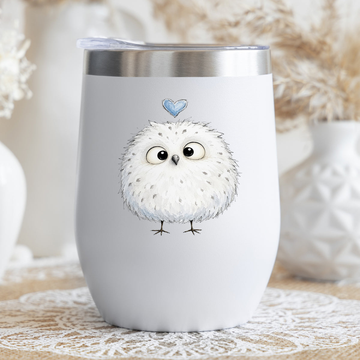 Fluffy White Owl UV DTF sticker applied to a white stemless tumbler with a lid