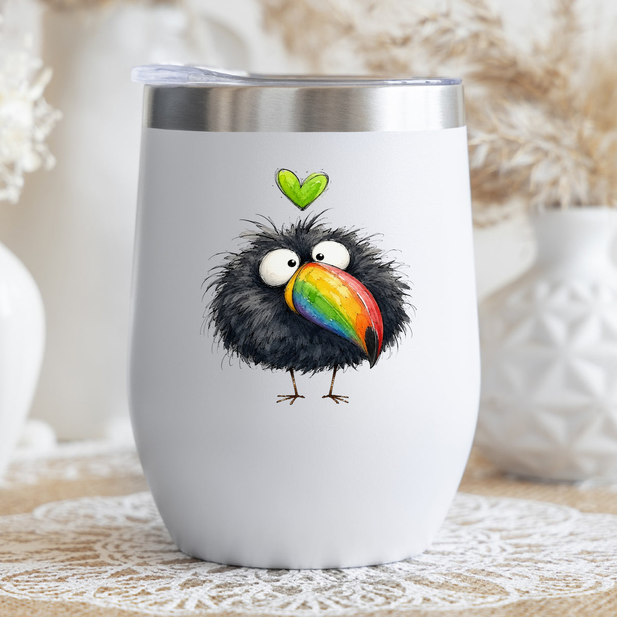 Funny Toucan Rainbow Beak UV DTF sticker applied to a white stemless tumbler with a lid