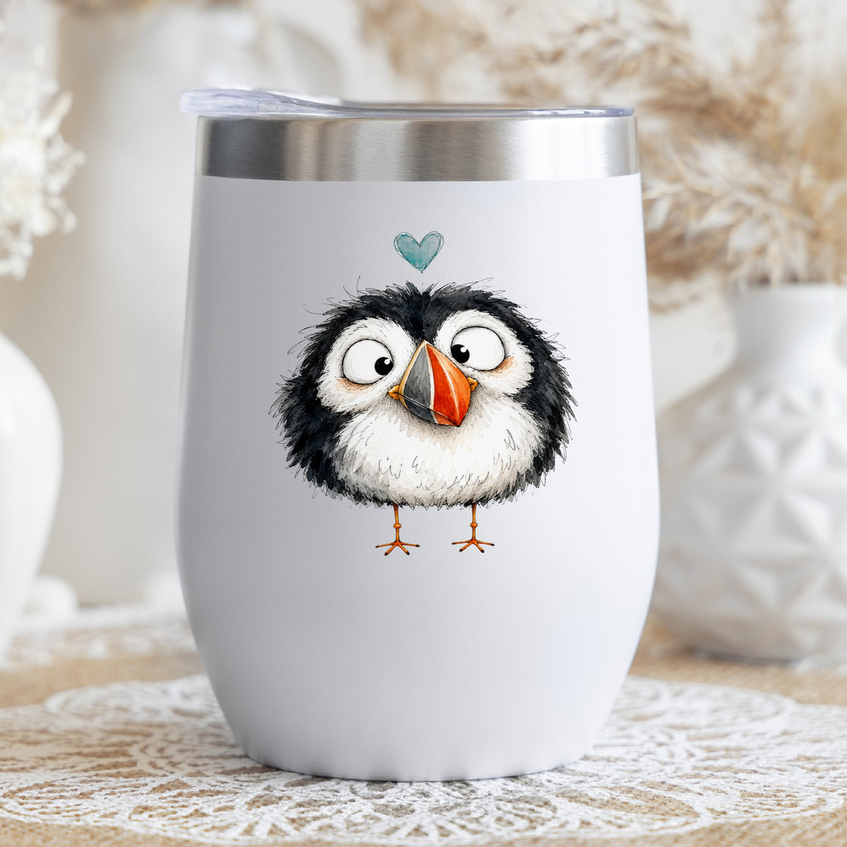 Cartoon Puffin UV DTF sticker applied to a white stemless tumbler with a lid
