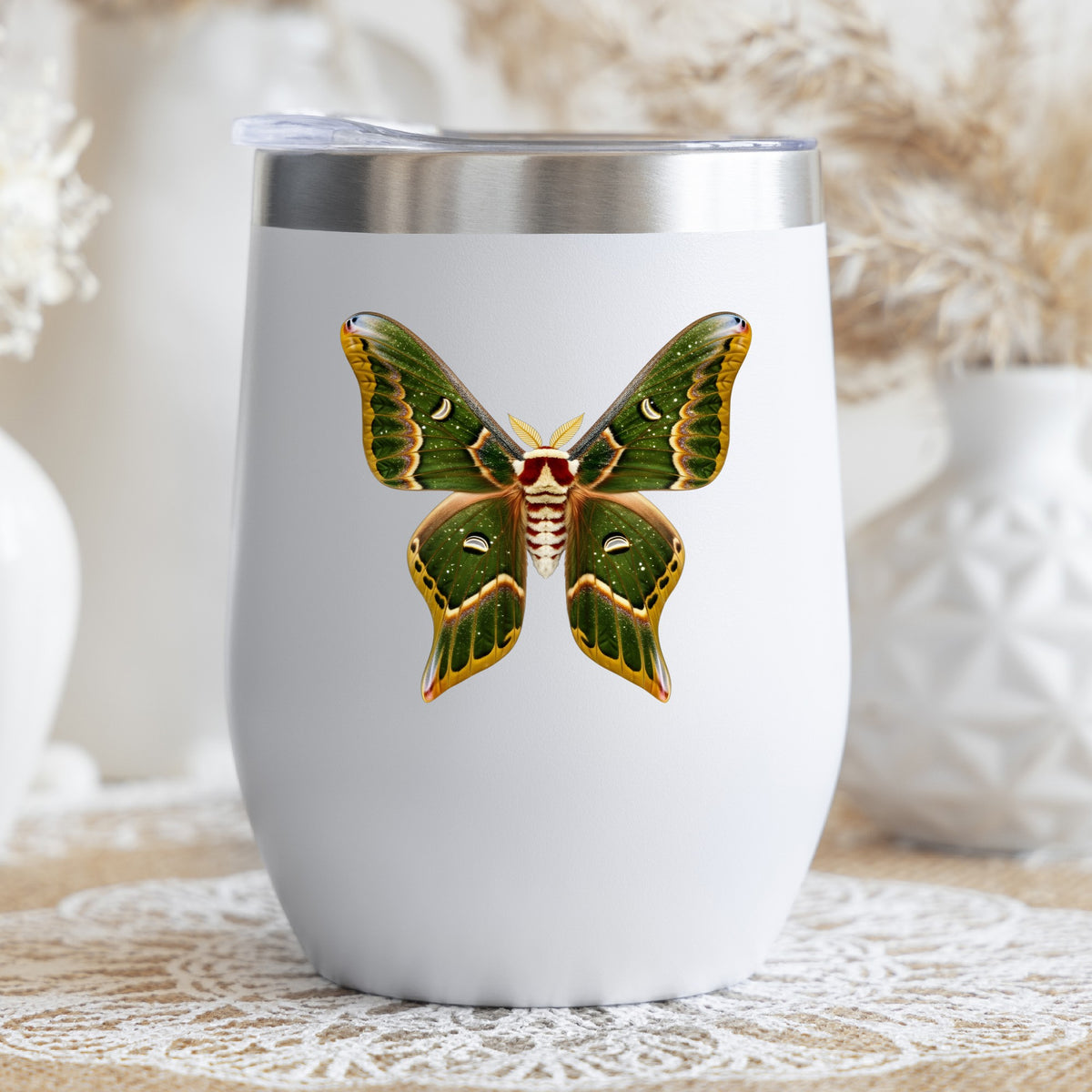Olive Green Moth UV DTF sticker applied to a white stemless tumbler with a lid