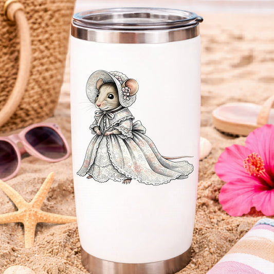 Mouse In Lace Bonnet Dress UV DTF sticker applied to a white travel tumbler on beach sand