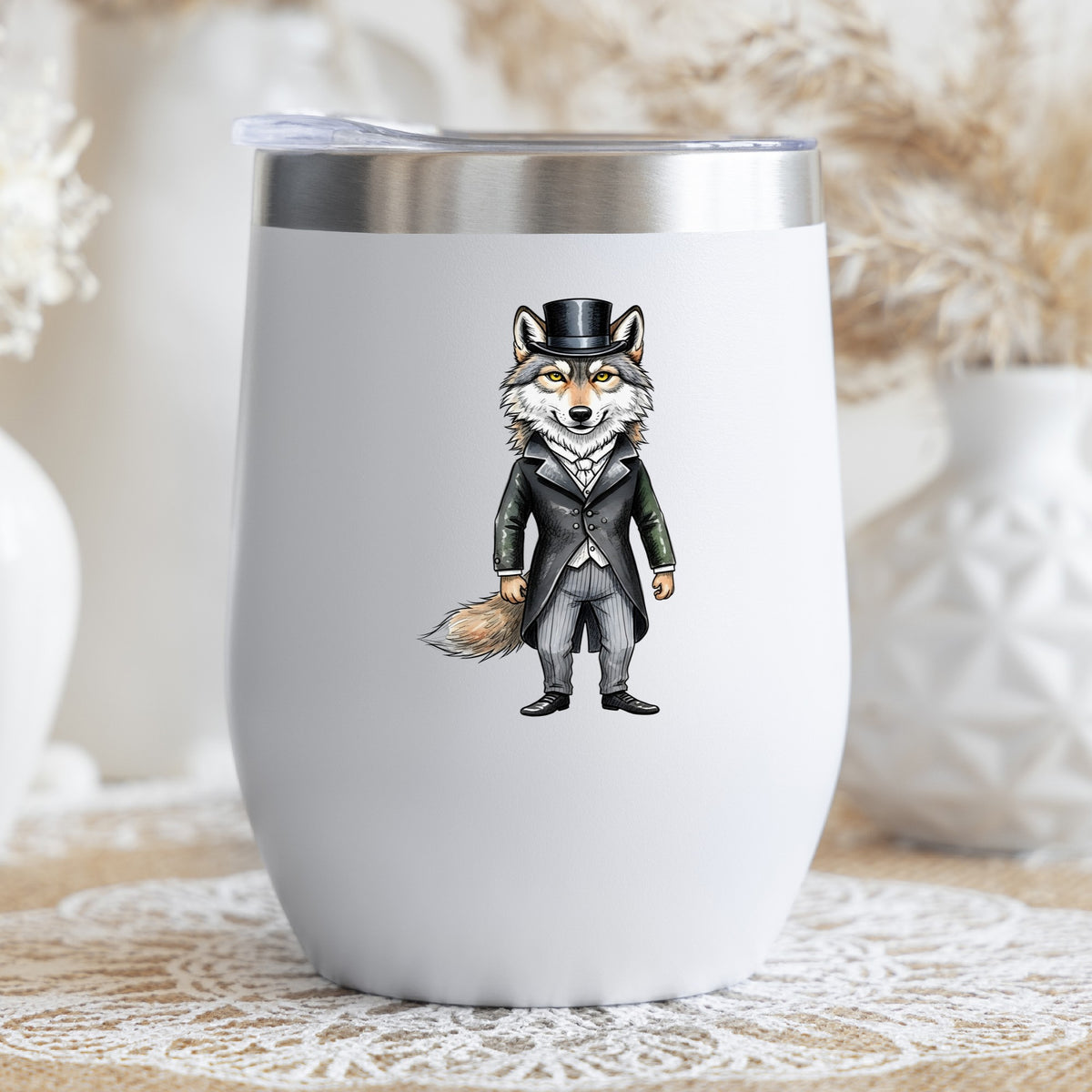 Gray Wolf Top Hat Tailcoat UV DTF sticker applied to a white stemless tumbler with a lid