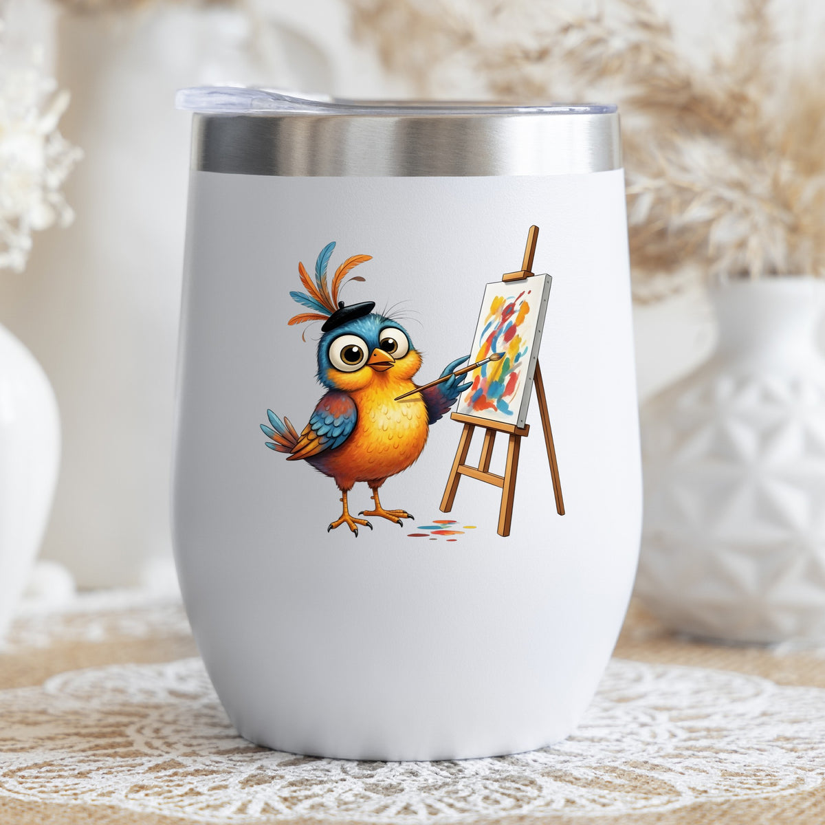 Artist Bird Painting Easel Beret UV DTF sticker applied to a white stemless tumbler with a lid
