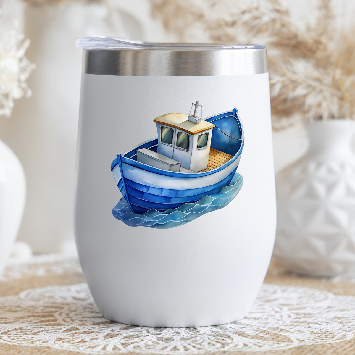 Blue Fishing Boat On Waves UV DTF sticker applied to a white stemless tumbler with a lid