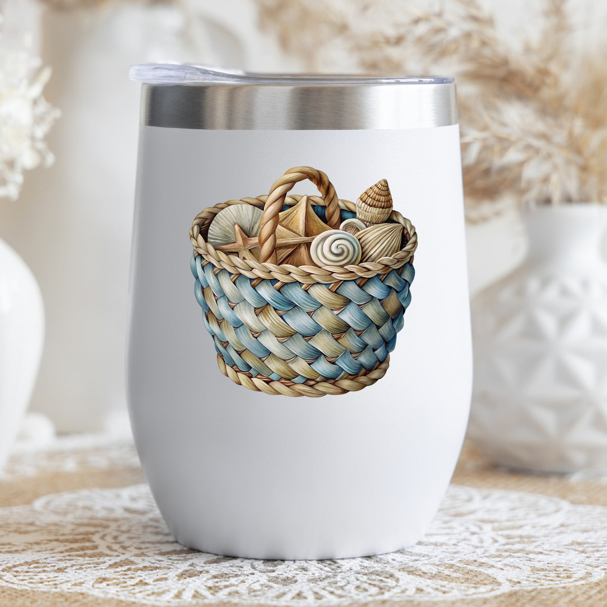 Woven Basket Of Seashells UV DTF sticker applied to a white stemless tumbler with a lid
