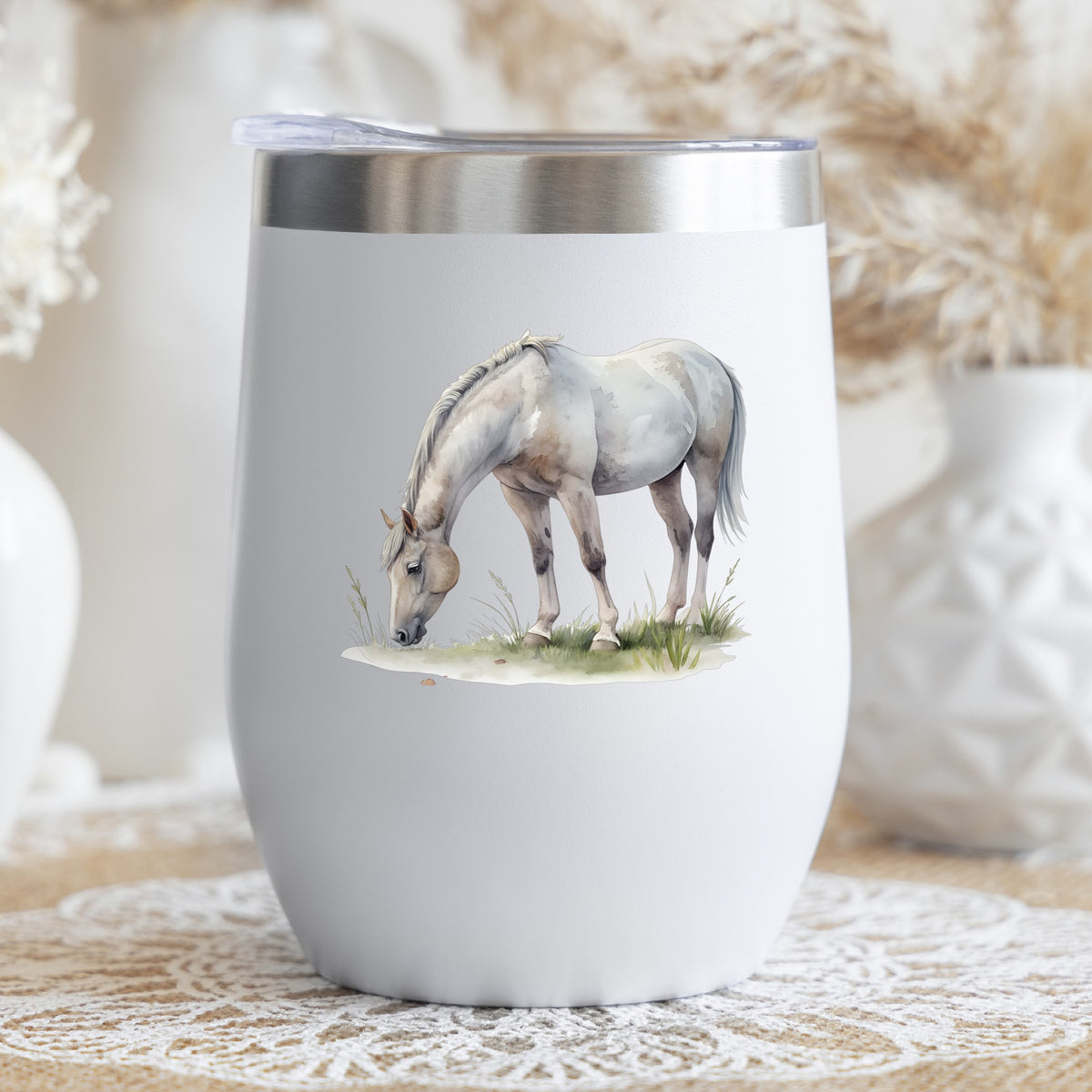 Gray Horse Grazing On Grass UV DTF sticker applied to a white stemless tumbler with a lid