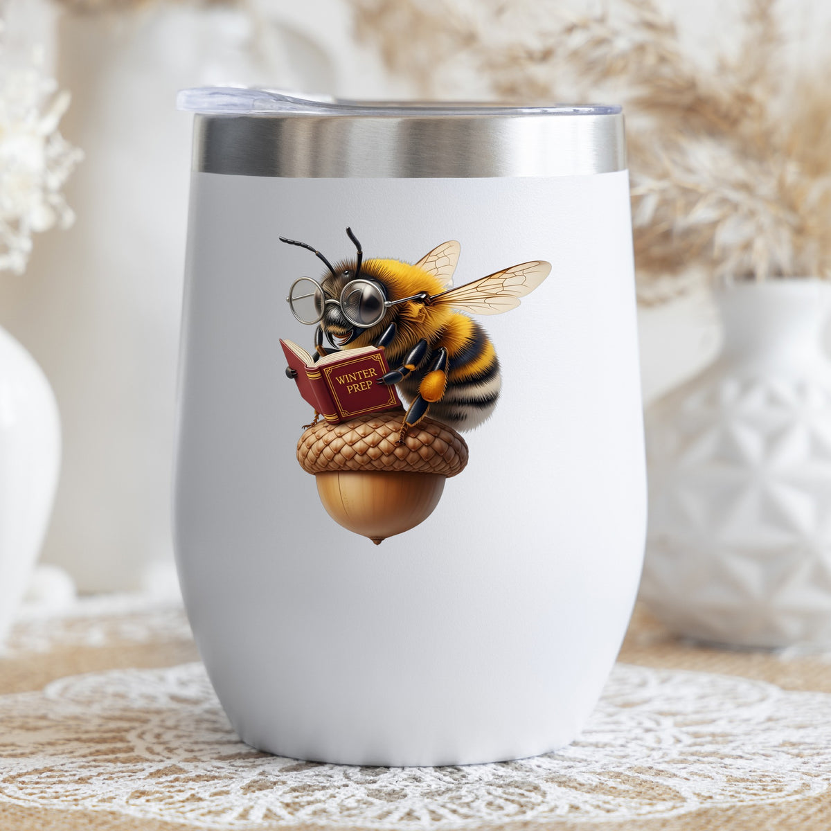 Bee Reading Book On Acorn UV DTF sticker applied to a white stemless tumbler with a lid