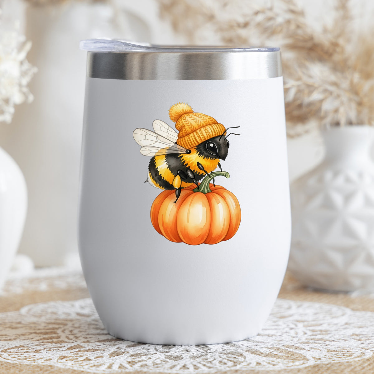 Bee In Orange Beanie On Pumpkin UV DTF sticker applied to a white stemless tumbler with a lid