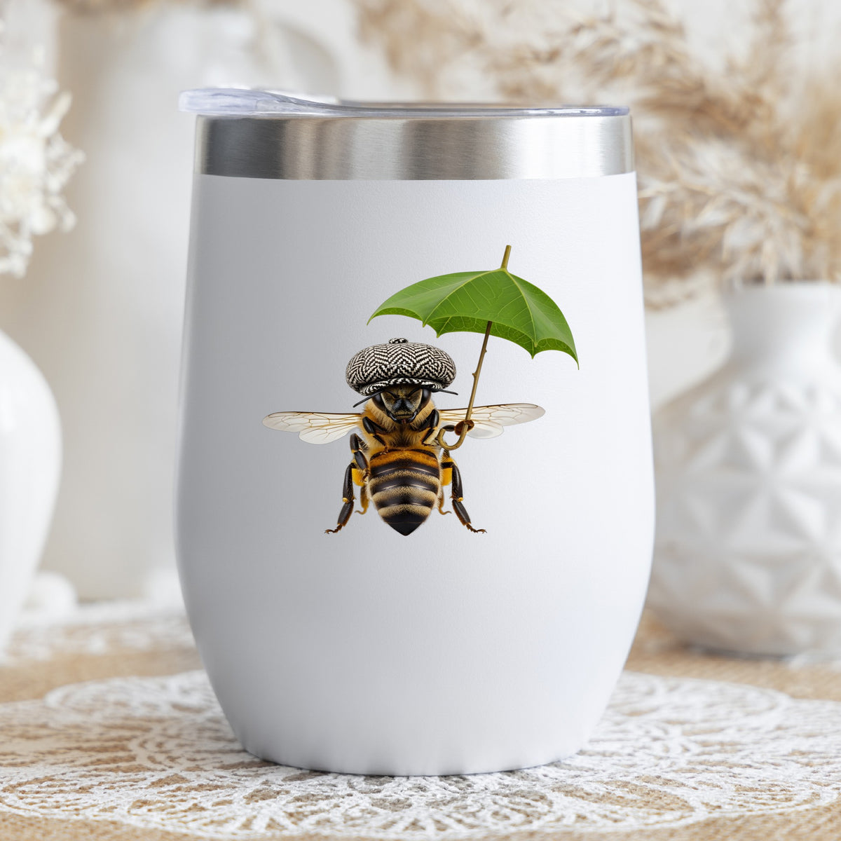 Bee In Flat Cap With Leaf Umbrella UV DTF sticker applied to a white stemless tumbler with a lid