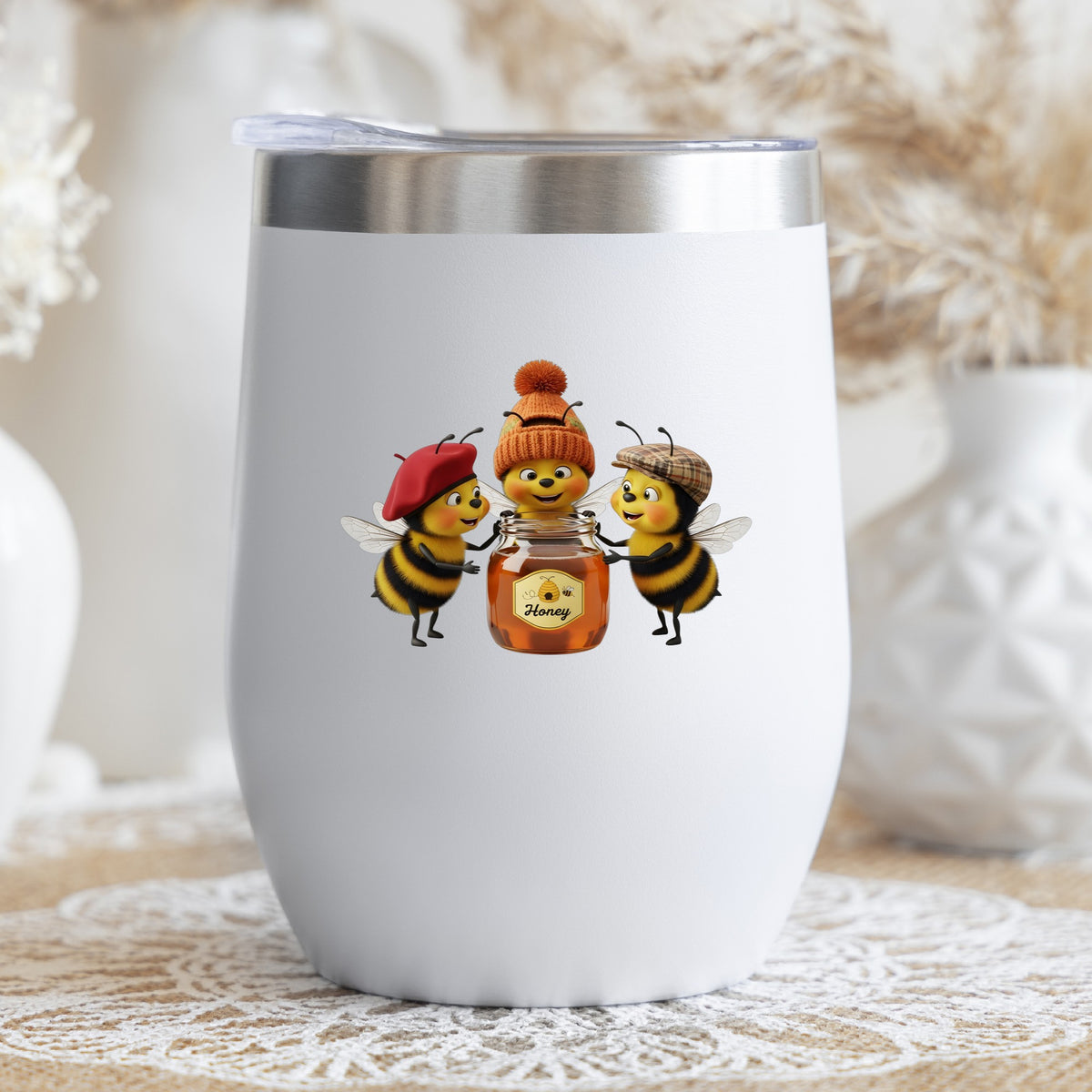 Three Bees With Honey Jar UV DTF sticker applied to a white stemless tumbler with a lid