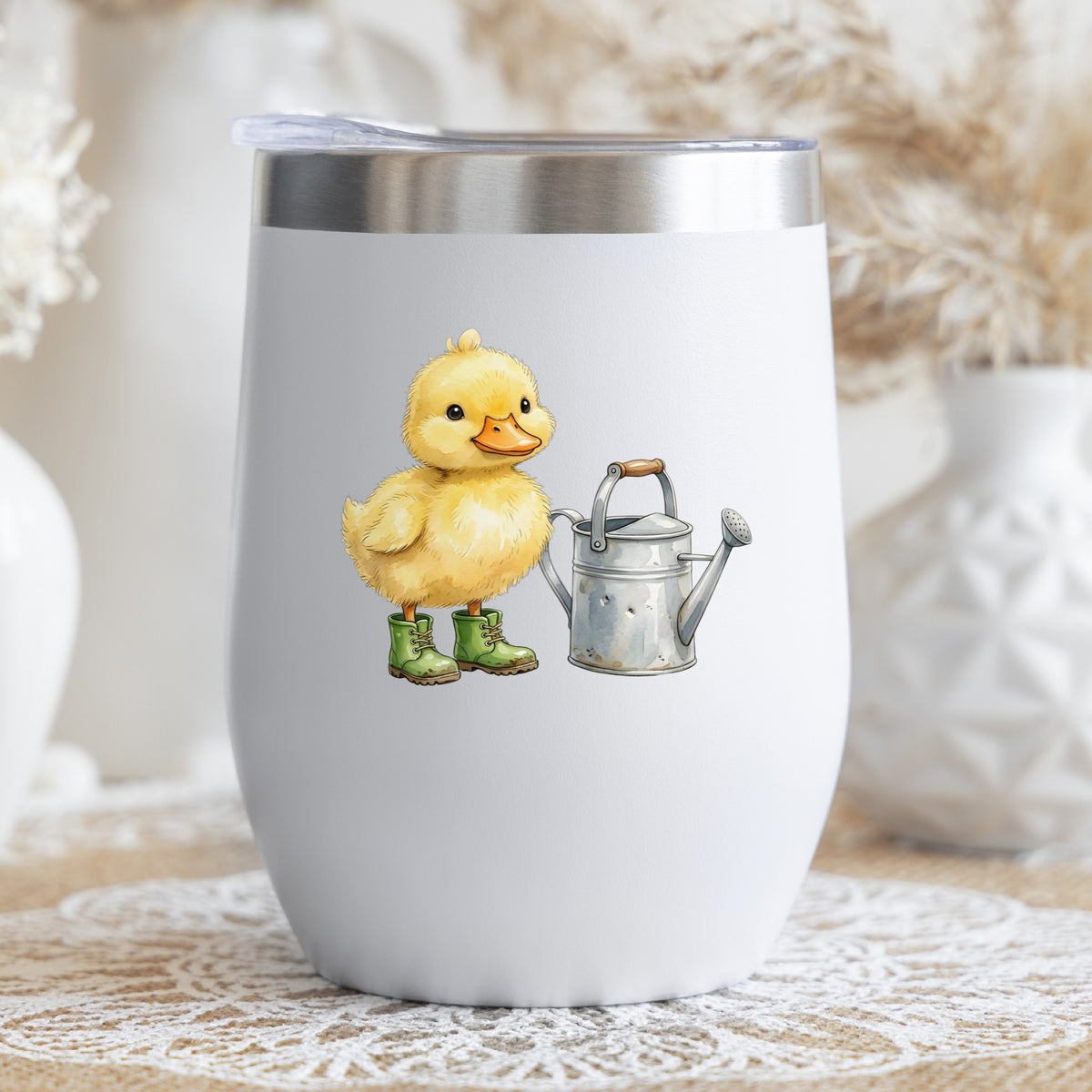 Duckling In Boots With Watering Can UV DTF sticker applied to a white stemless tumbler with a lid