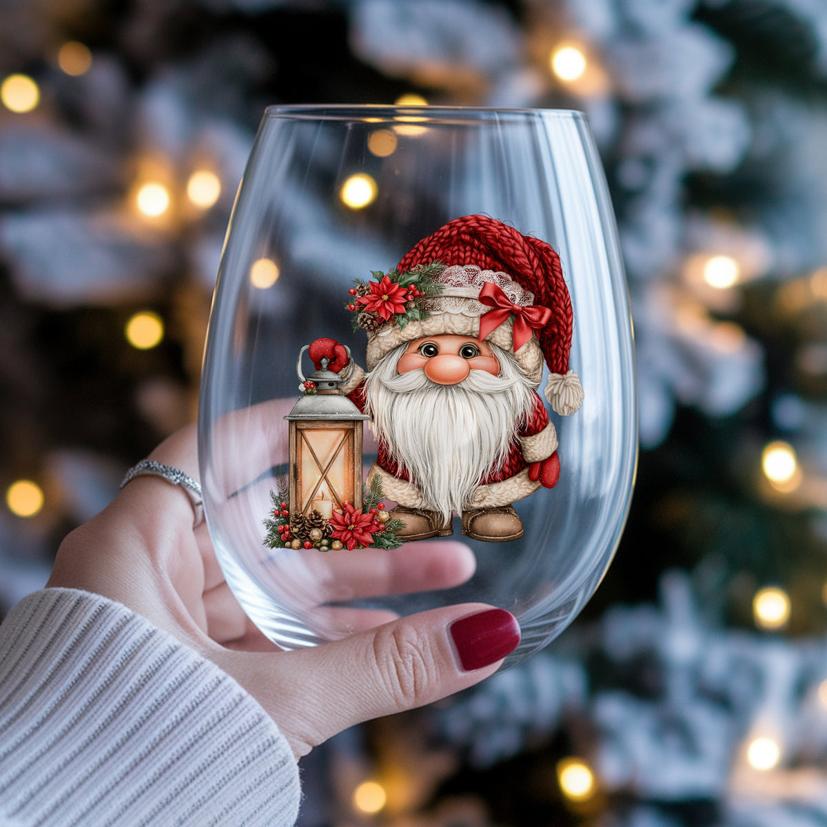 Gnome With Glowing Lantern UV DTF sticker applied to a stemless wine glass held in hand