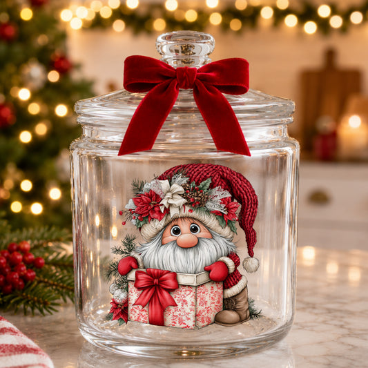 Gnome Peeking From Gift Box UV DTF sticker applied to a glass candy jar tied with a red bow