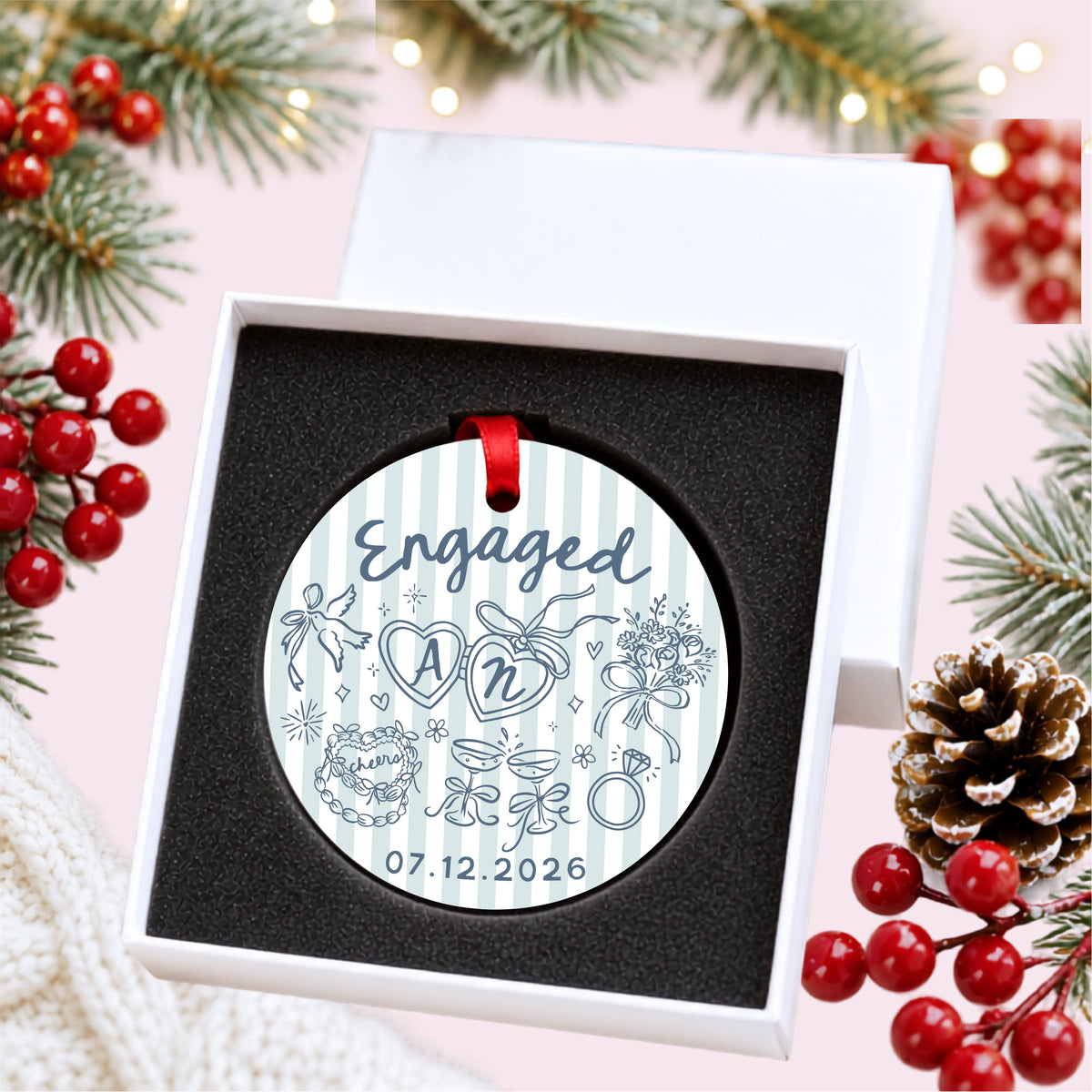 Personalized blue striped engagement ornament with initials and full date, presented inside a white gift box with protective foam