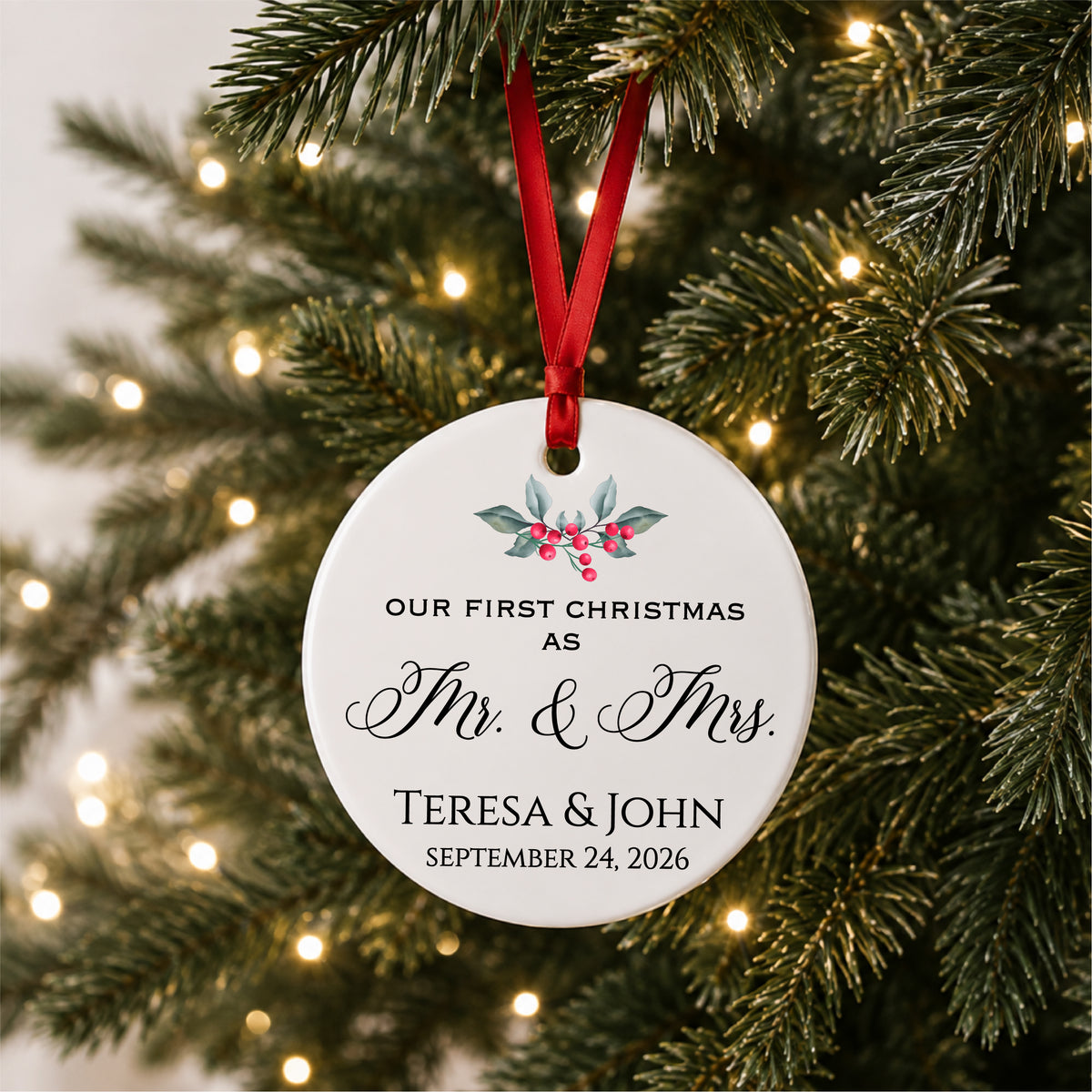 Personalized first Christmas as Mr. and Mrs. ornament with holly, couple names and wedding date, hanging on a lit Christmas tree