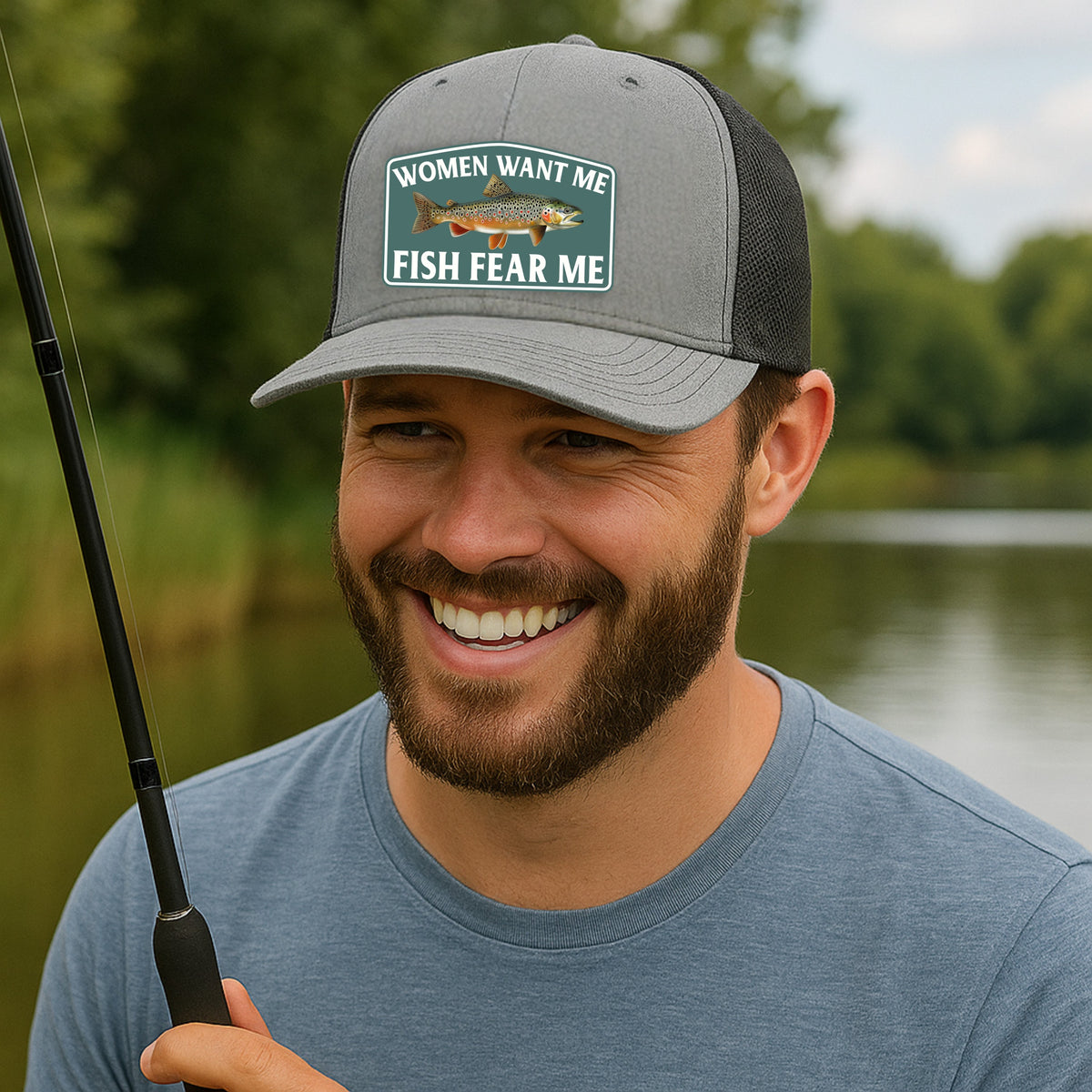 Man wearing Fish Fear Me trucker hat while fishing outdoors, Richardson 112 in heather gray and black
