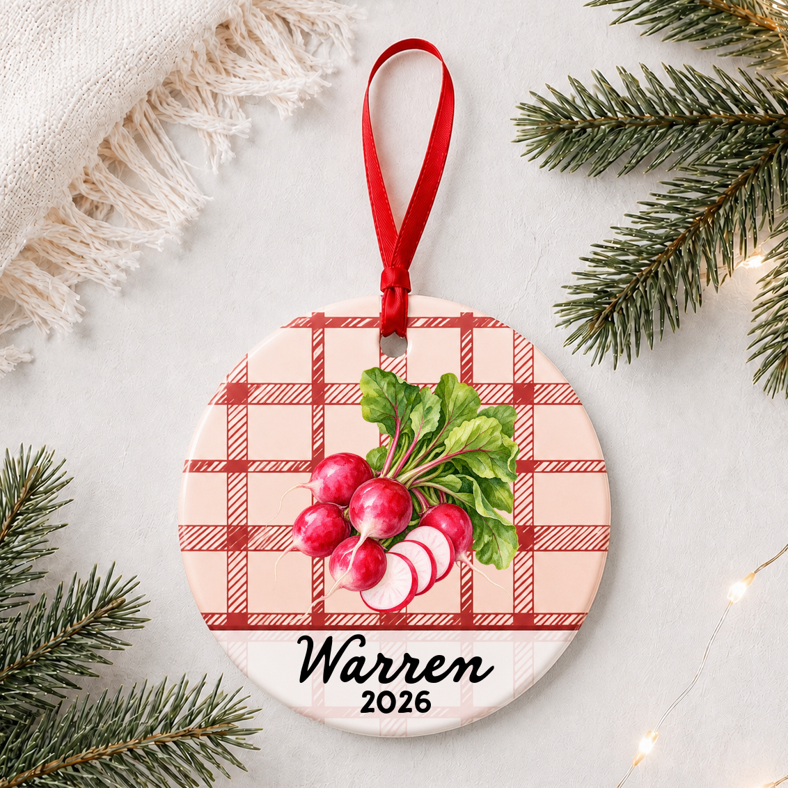 Personalized radishes ceramic ornament with name and year on red plaid styled with pine branches on a soft white background