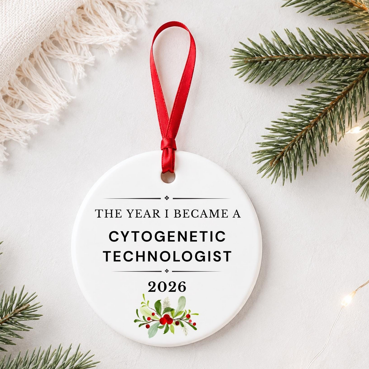 Cytogenetic Technologist 2026 ceramic ornament reading The Year I Became a Cytogenetic Technologist styled with pine branches on a soft white background