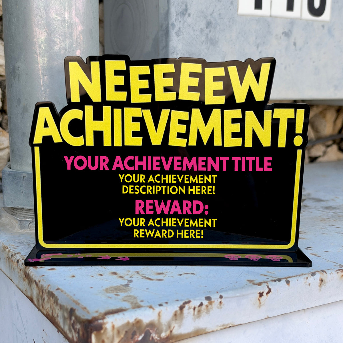 Custom achievement desk sign showing where your title, description and reward will appear
