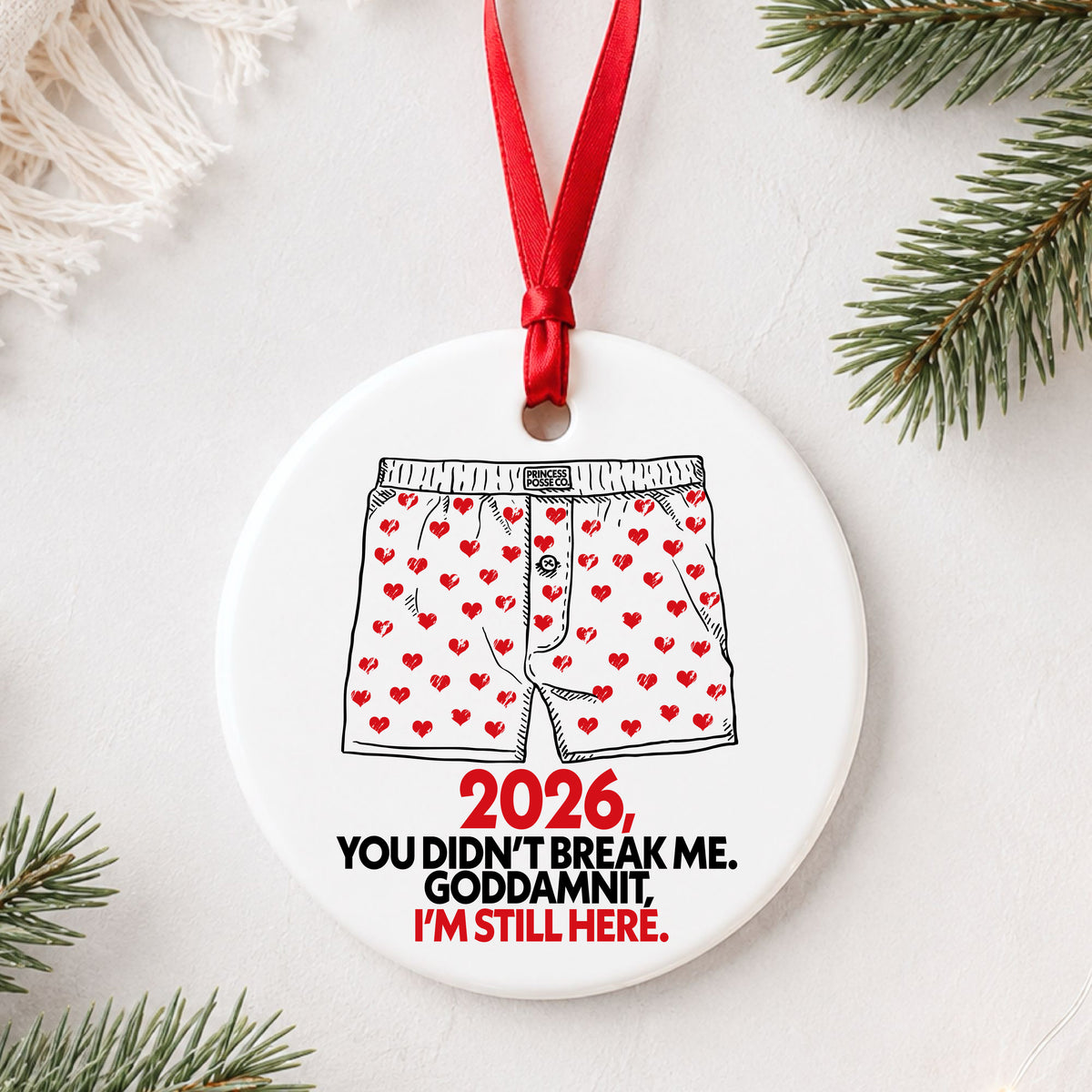 Dungeon Crawler Carl heart boxers 2026 ornament flat lay on white with greenery