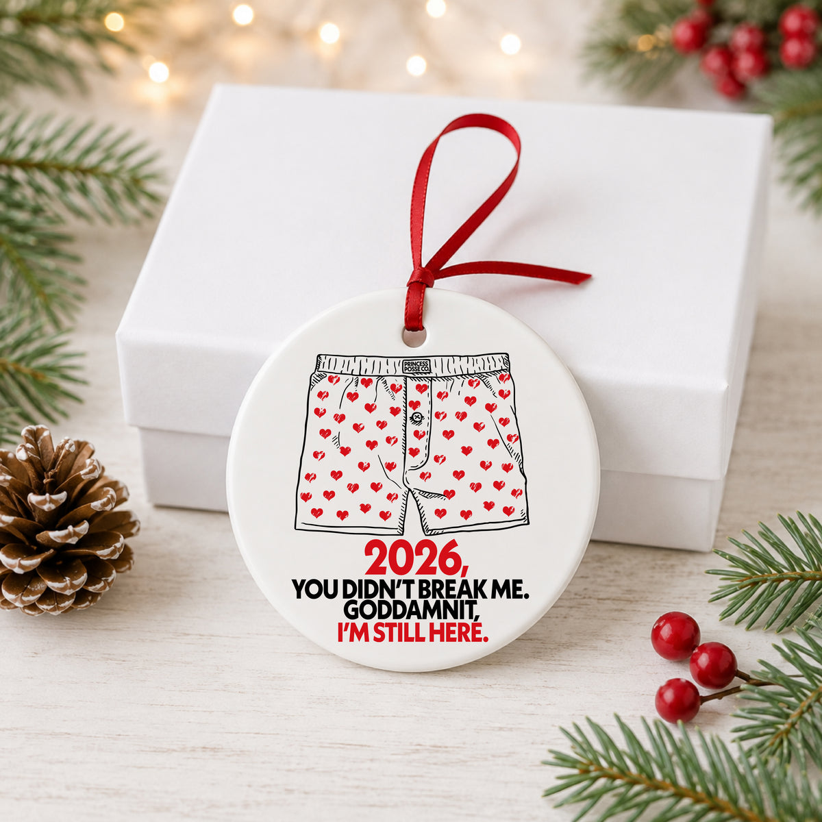 Dungeon Crawler Carl heart boxers 2026 ornament hanging beside a white gift box