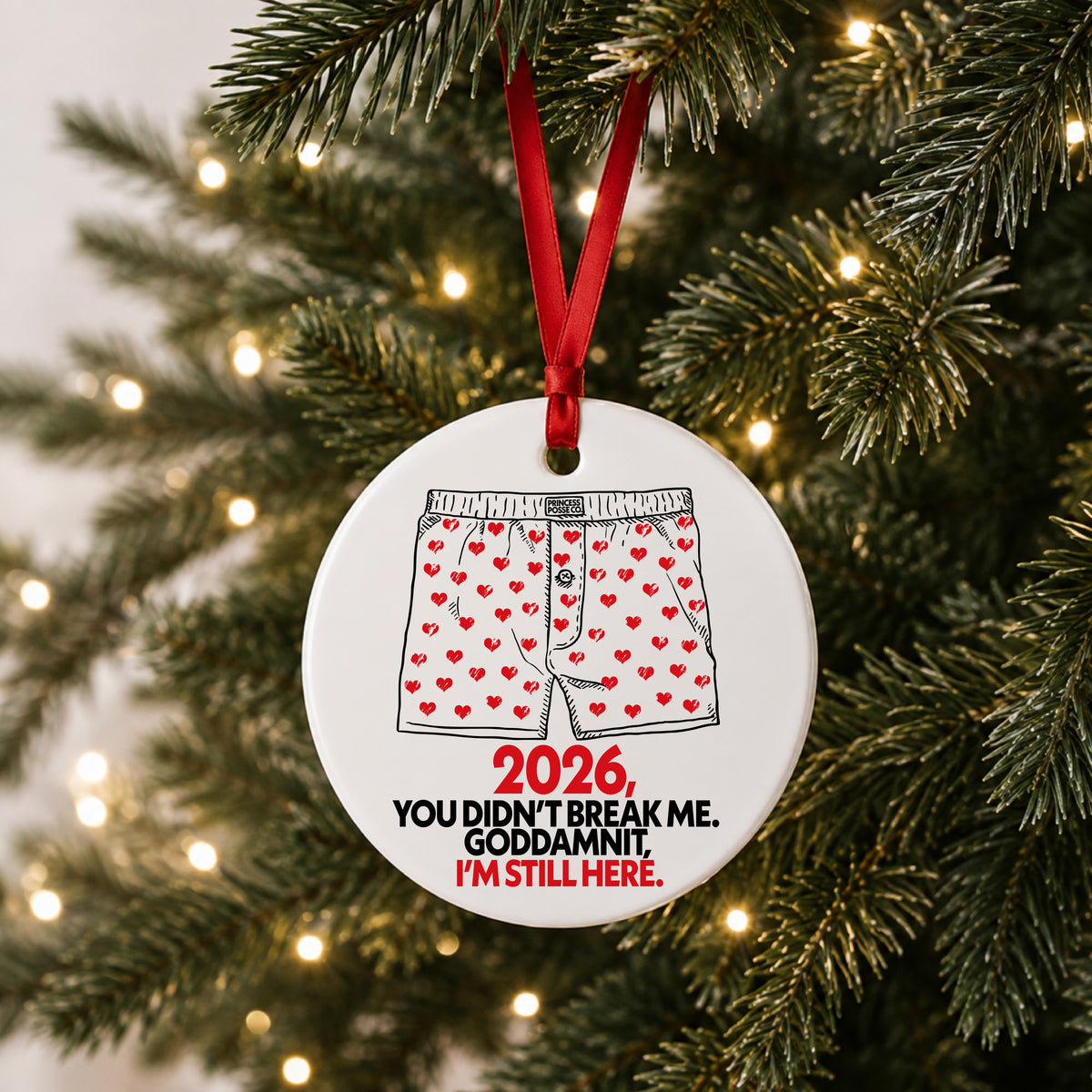 Dungeon Crawler Carl heart boxers 2026 ornament hanging on a lit Christmas tree