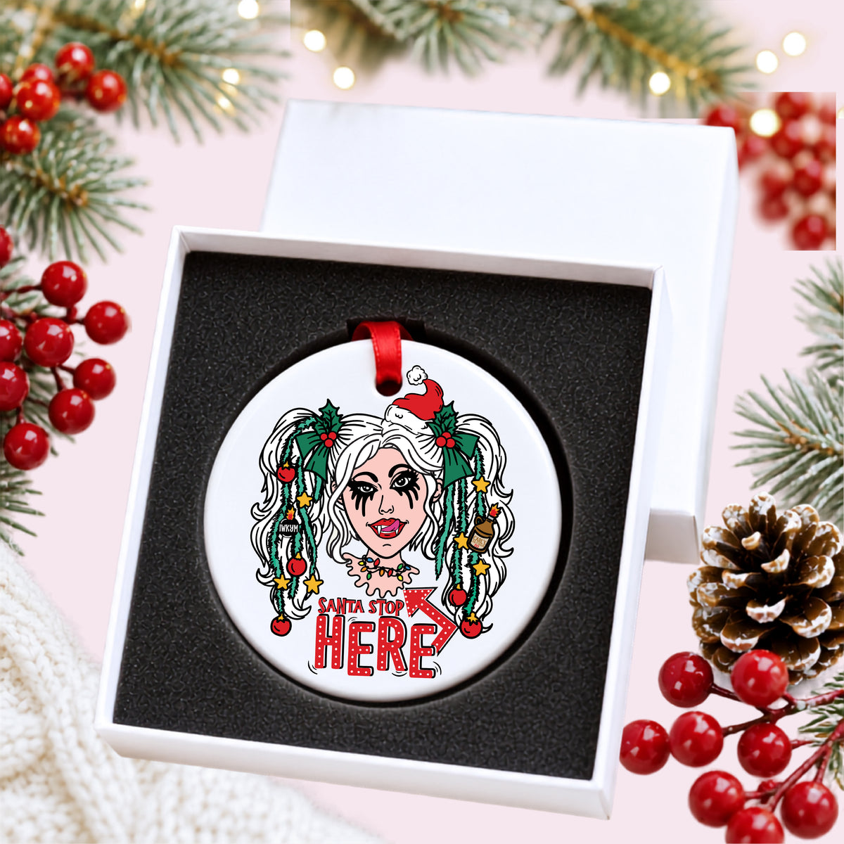 Dungeon Crawler Carl Samantha Santa Stop Here ornament in an open white gift box with foam