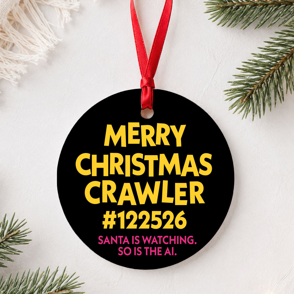 Personalized Merry Christmas Crawler ornament (example crawler number shown) flat lay on white with greenery