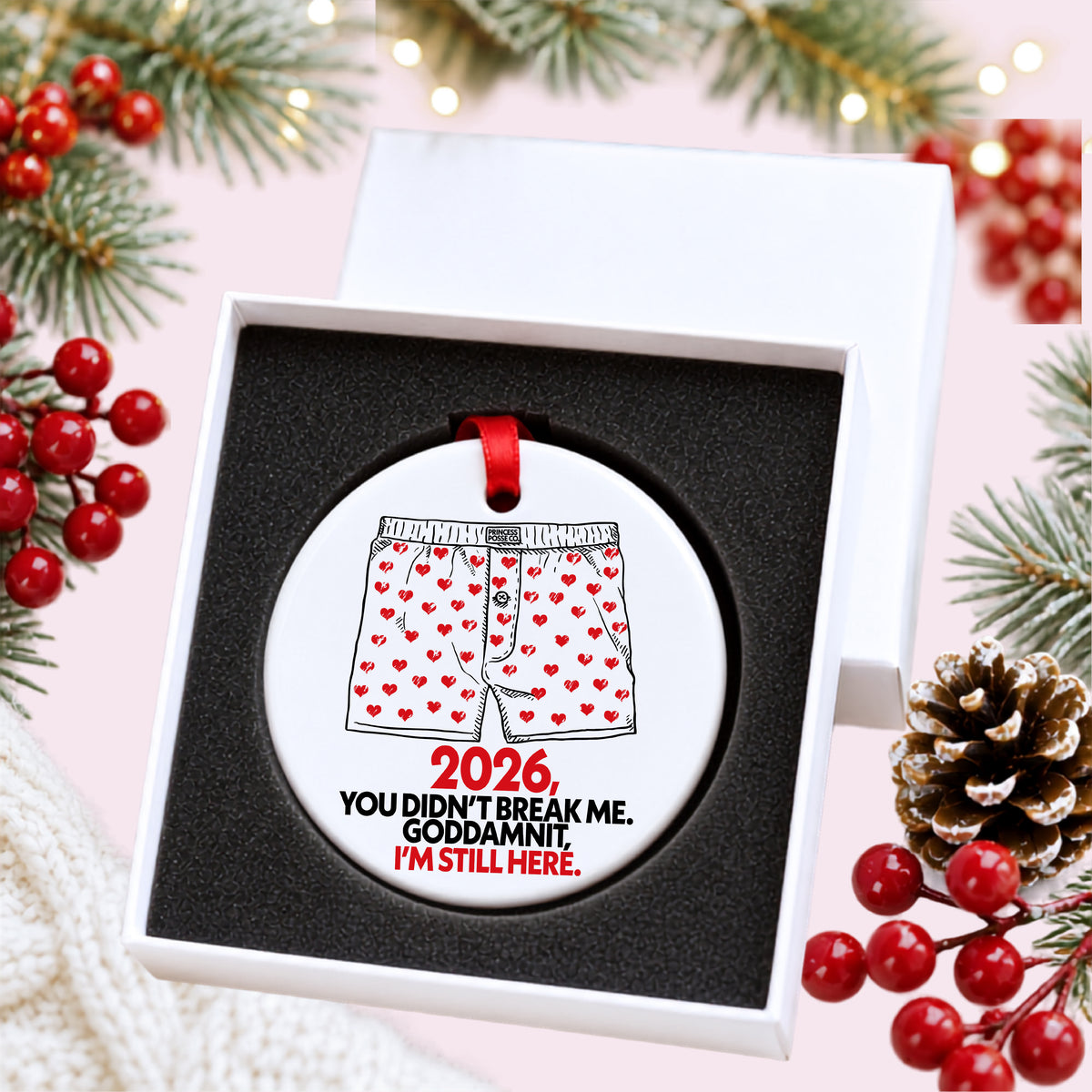 Dungeon Crawler Carl heart boxers 2026 ornament in an open white gift box with foam