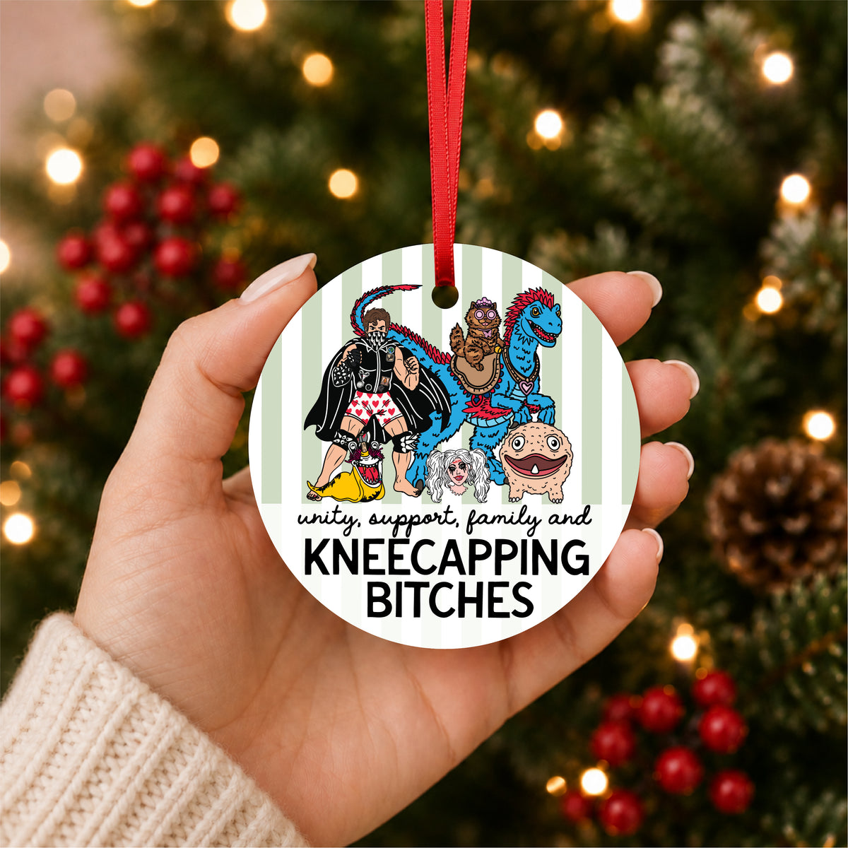 Dungeon Crawler Carl Sluggalo code ornament with Carl, Princess Donut, Mongo, Samantha, Biggs and Rend held in hand in front of a lit Christmas tree