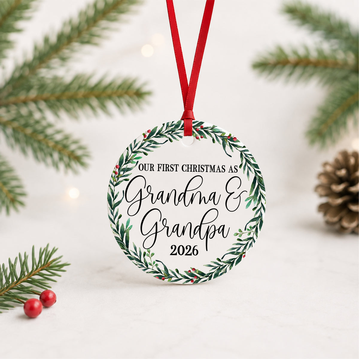 Grandma and Grandpa first Christmas ornament hanging against a light holiday backdrop