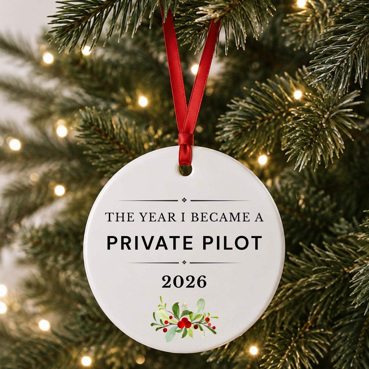 Private Pilot 2026 ceramic ornament reading The Year I Became a Private Pilot hanging on a lit Christmas tree