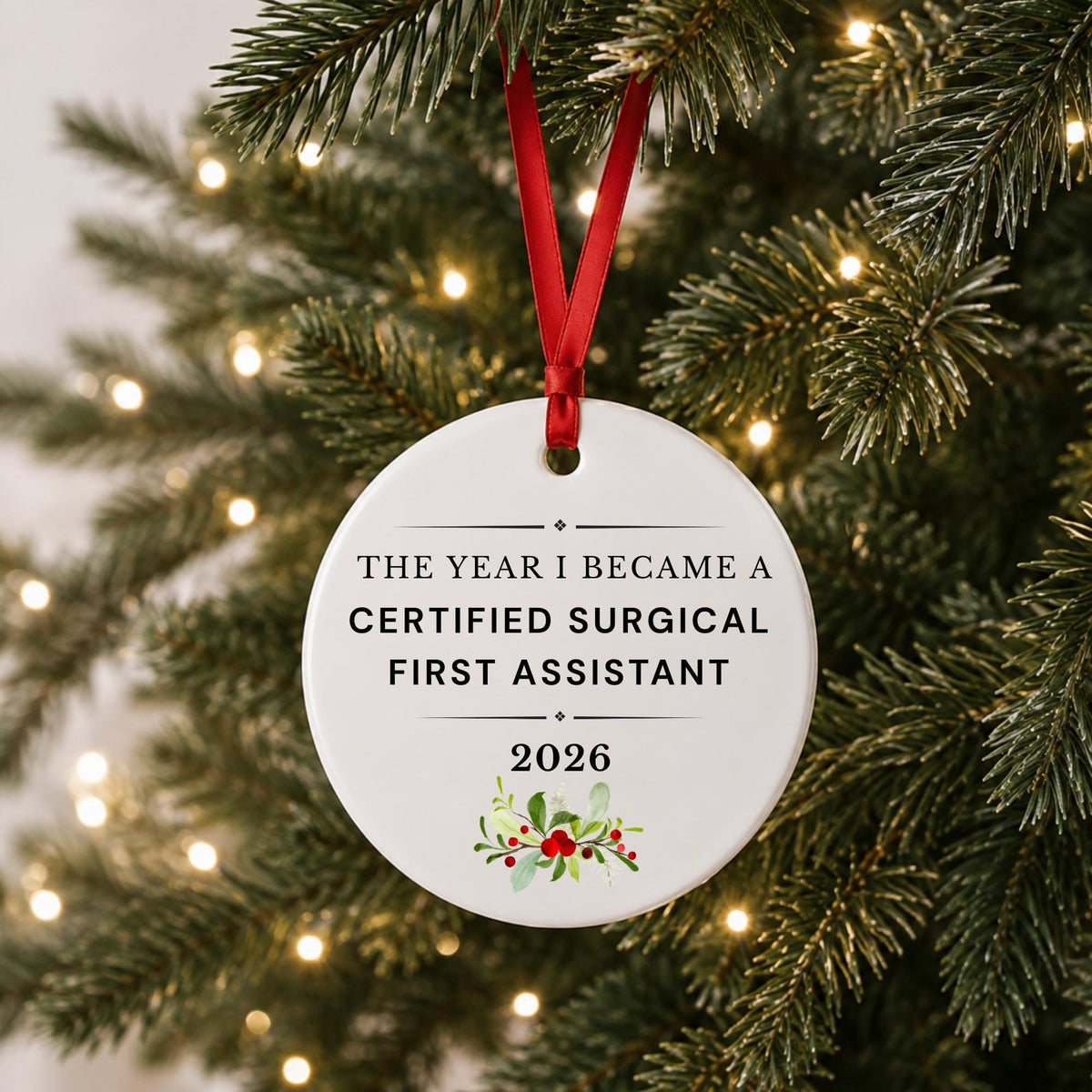 Certified Surgical First Assistant 2026 ceramic ornament reading The Year I Became a Certified Surgical First Assistant hanging on a lit Christmas tree