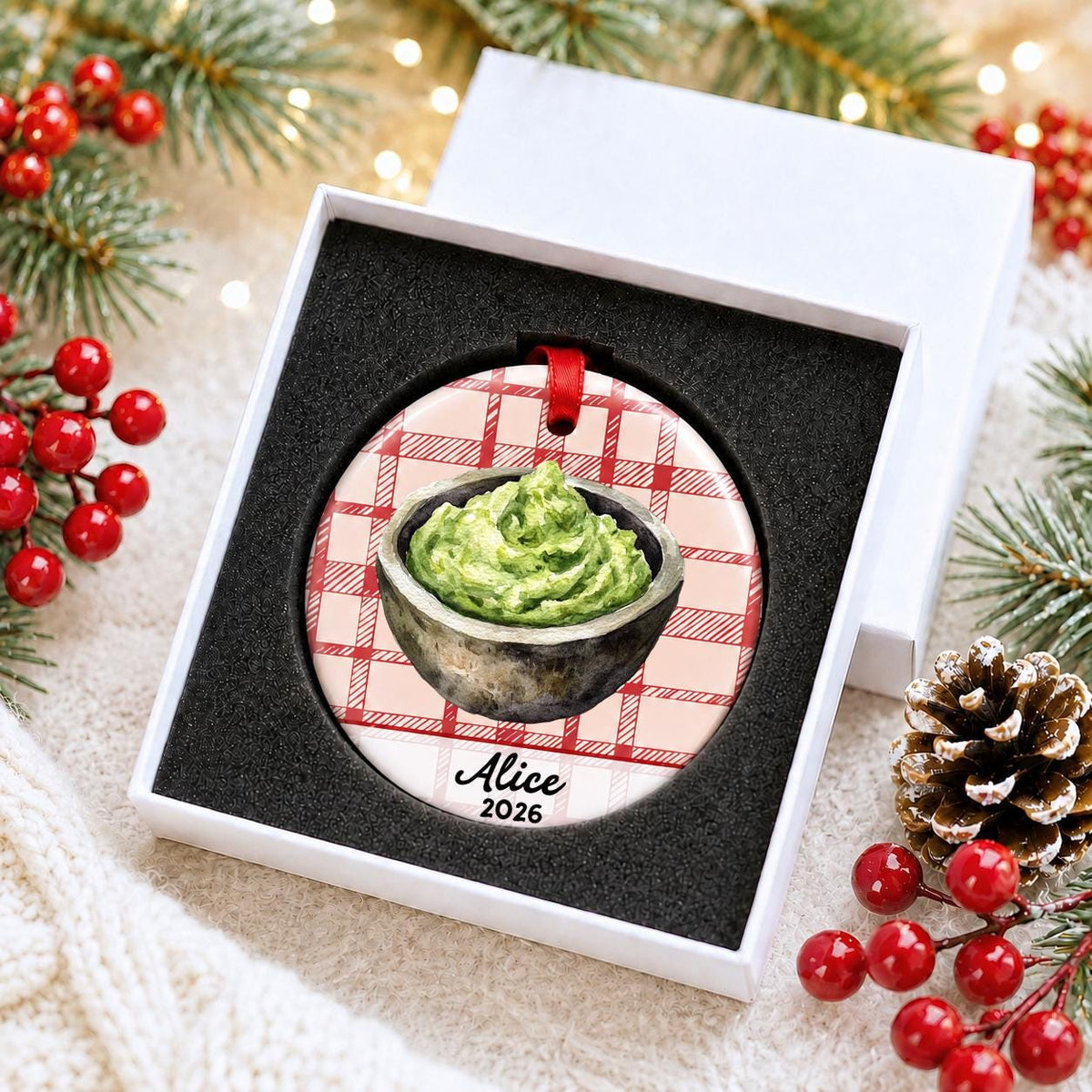 Personalized guacamole ceramic ornament with name and year on red plaid in a white gift box with protective foam
