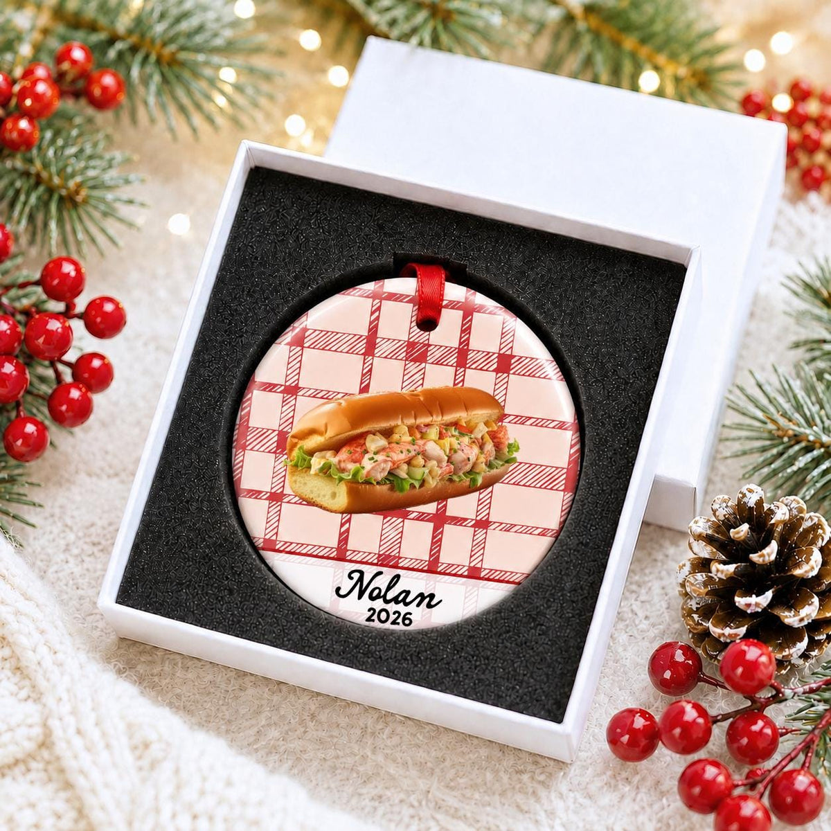 Personalized lobster roll ceramic ornament with name and year on red plaid in a white gift box with protective foam