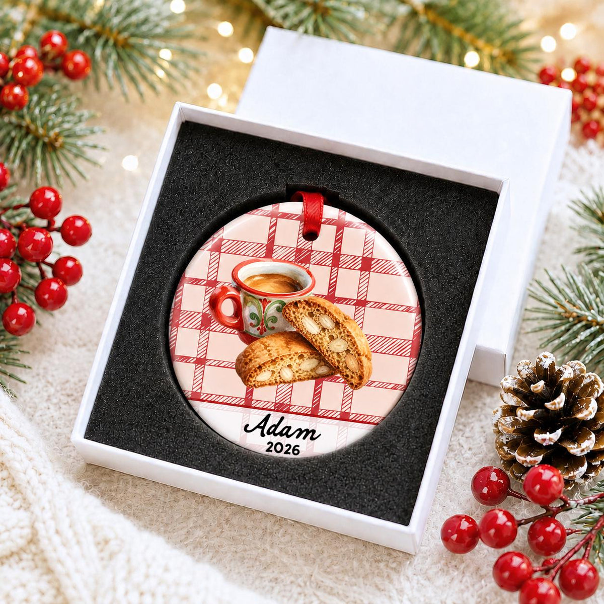 Personalized espresso and biscotti ceramic ornament with name and year on red plaid in a white gift box with protective foam