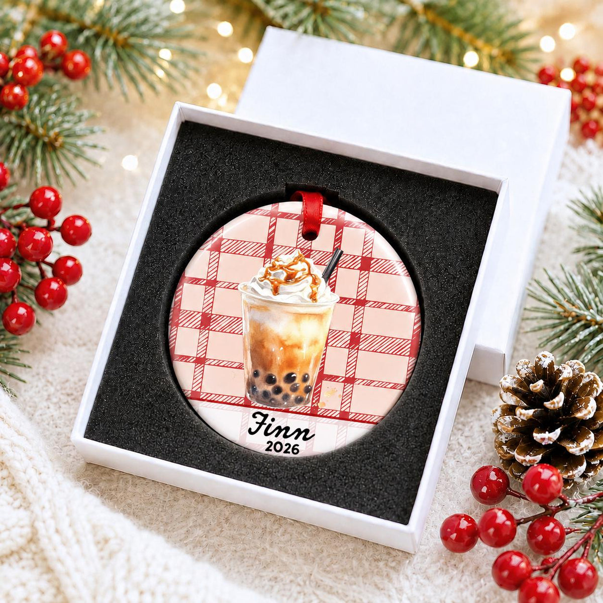 Personalized brown sugar boba ceramic ornament with name and year on red plaid in a white gift box with protective foam