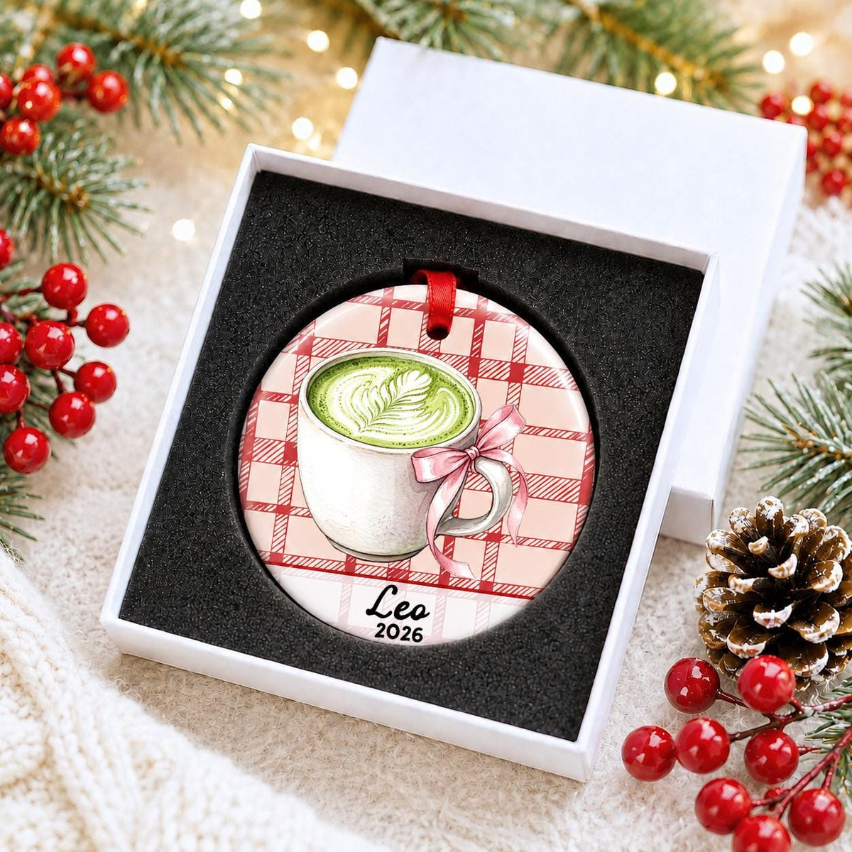 Personalized matcha latte ceramic ornament with name and year on red plaid in a white gift box with protective foam