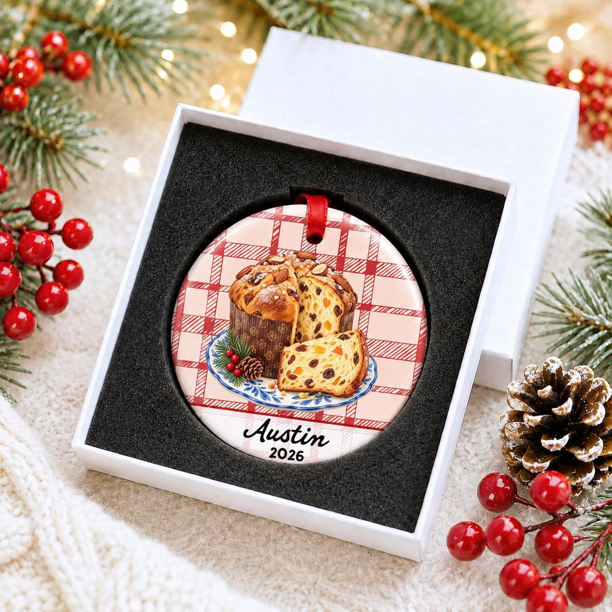 Personalized panettone ceramic ornament with name and year on red plaid in a white gift box with protective foam