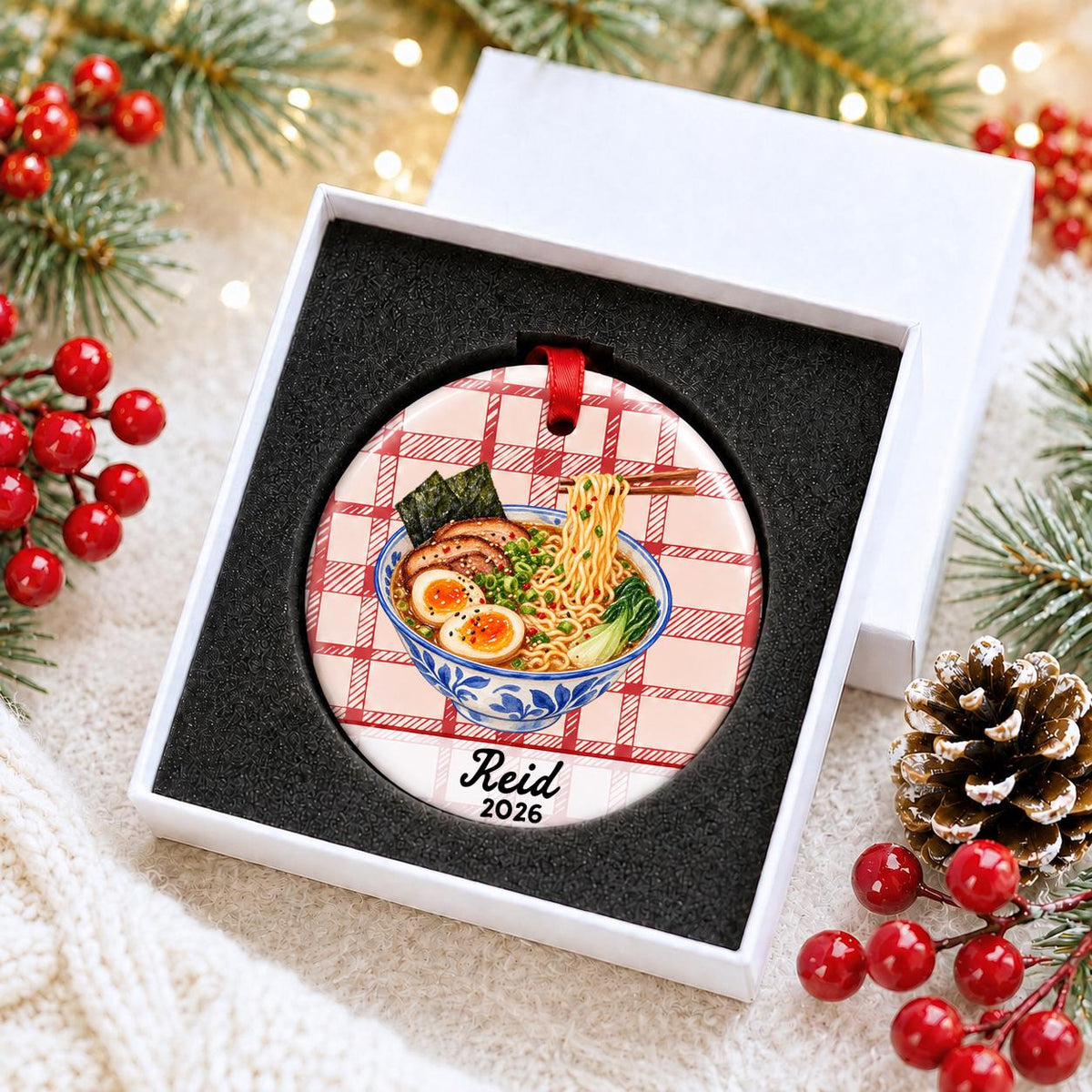 Personalized ramen ceramic ornament with name and year on red plaid in a white gift box with protective foam